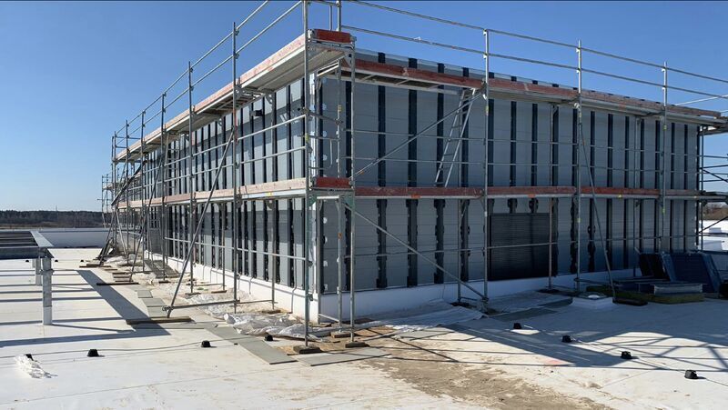 Other trades working on the roof during construction phase