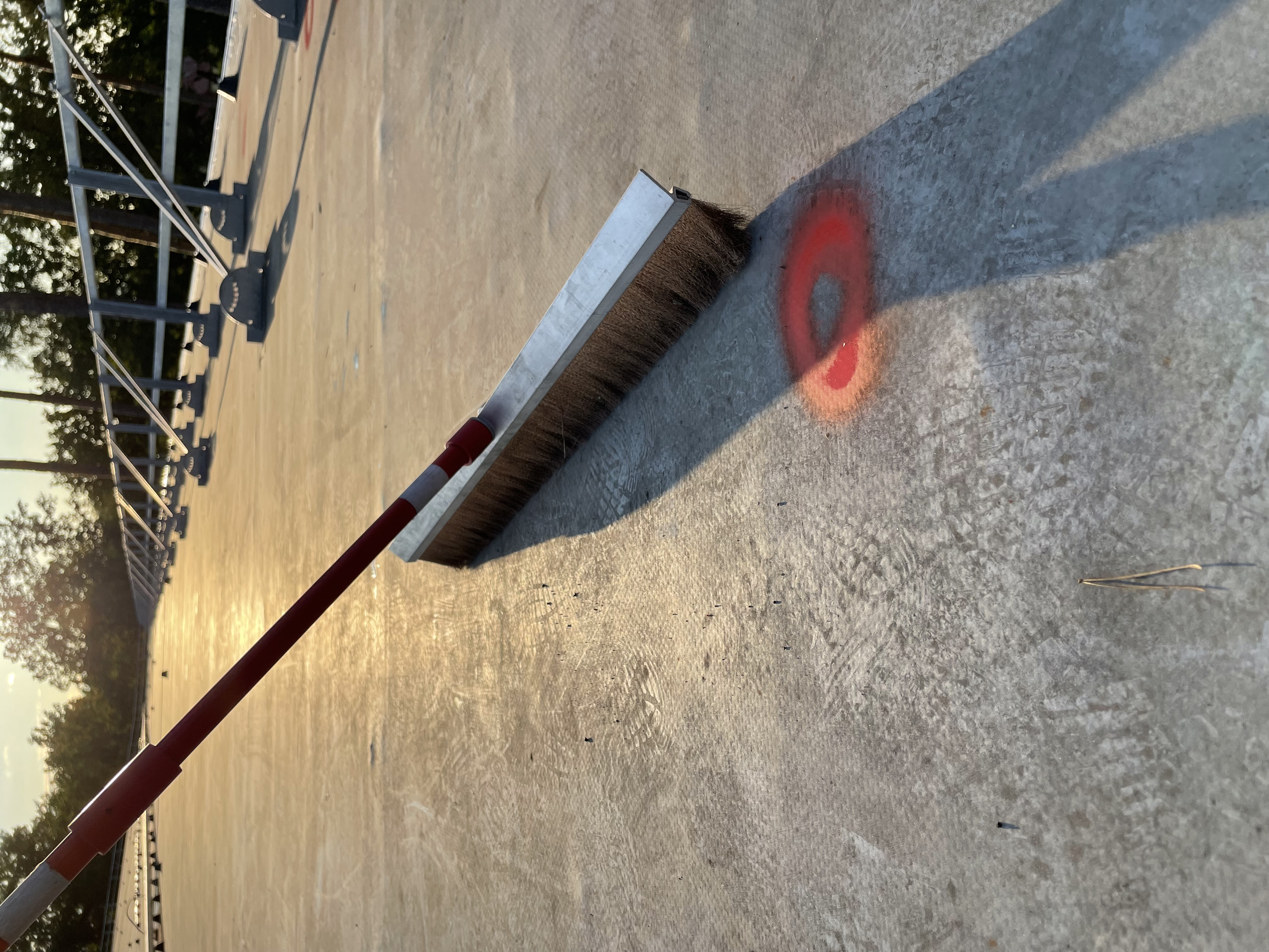 ELD inspection in progress — technician sweeping rooftop membrane